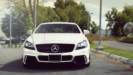 Sleek White Mercedes CLS in Natural Setting wallpaper