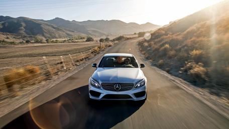 Sleek Mercedes on a Scenic Mountain Road wallpaper