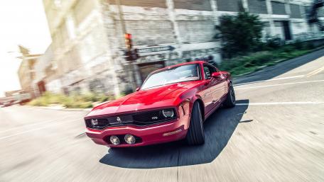 Classic Red Muscle Car in Motion wallpaper