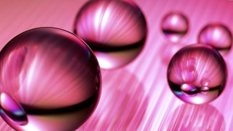 Radiant Pink Spheres in Motion wallpaper