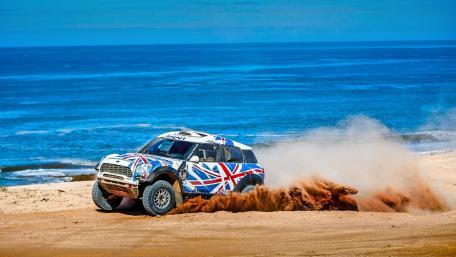 Racing Through Sandy Shores with Style wallpaper
