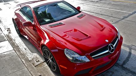 Sleek Red Mercedes Sports Car Wallpaper wallpaper