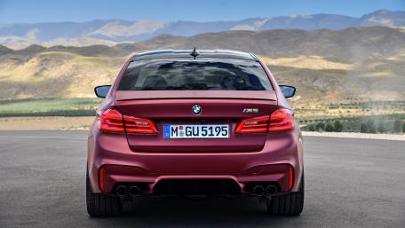 Sleek BMW M5 Against a Scenic Backdrop wallpaper