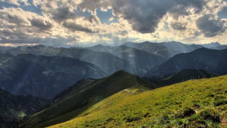 Majestic Mountain Scenery bathed in Sunlight wallpaper