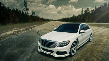Sleek White Car on Abandoned Track wallpaper