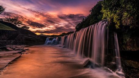 Majestic Waterfall at Sunset wallpaper