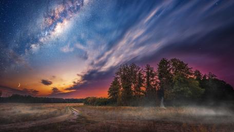Majestic Milky Way Over Serene Landscape wallpaper