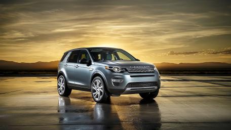 Sleek SUV Against a Stunning Sunset wallpaper