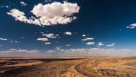 Winding Road Through Breathtaking Desert Scenery wallpaper