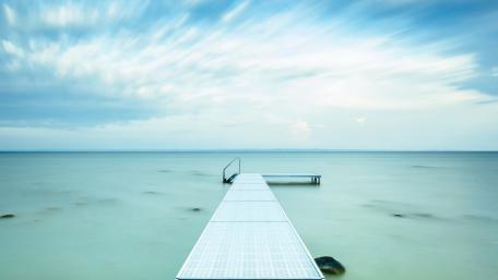 Serene Dock Over Tranquil Waters wallpaper