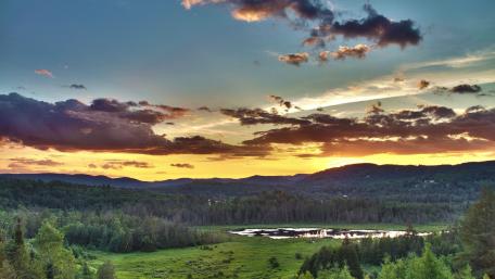Serene Sunset Over Tranquil Landscape wallpaper