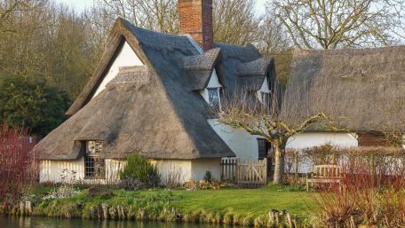 Charming Thatched Cottage by Tranquil Waters wallpaper