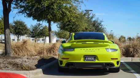 Vibrant Green Porsche 911 in Nature's Embrace wallpaper