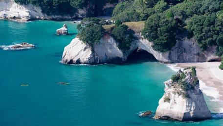 Serene Coastal Landscape with Emerald Waters wallpaper
