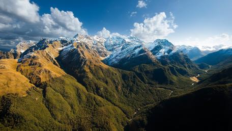 Majestic Mountain Range Under Clear Skies wallpaper