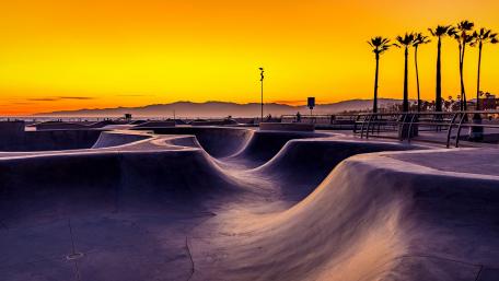 Golden Sunset over the Urban Skatepark Scene wallpaper