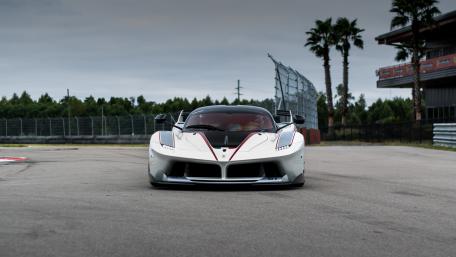 Sleek Elegance of a Supercar on the Track wallpaper