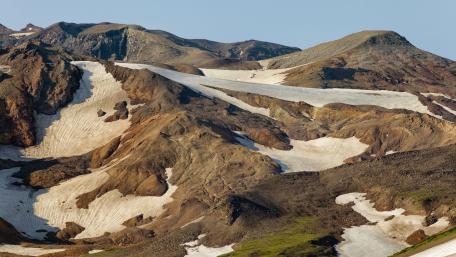 Majestic Mountain Landscape with Snow and Earthy Tones wallpaper
