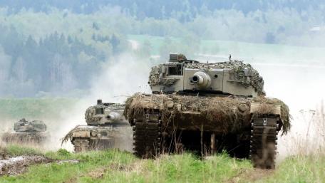 Tanks Advancing Through the Battlefield Scene wallpaper