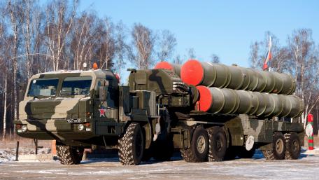 Military Vehicle with Missile System Displayed Outdoors wallpaper