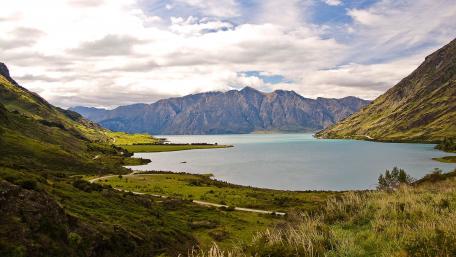 Serene Mountain Lake View Amidst Lush Greenery wallpaper