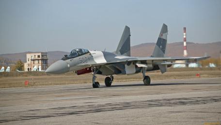 Sleek Fighter Jet on Military Runway wallpaper