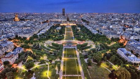 Paris Skyline at Dusk with Lush Gardens and City Lights wallpaper