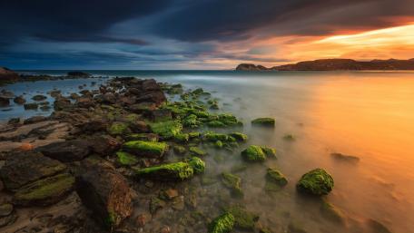 Serenity at Sunset Over Coastal Rocks wallpaper