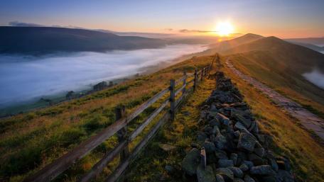 Stunning Sunrise Over Misty Hillside Landscape wallpaper