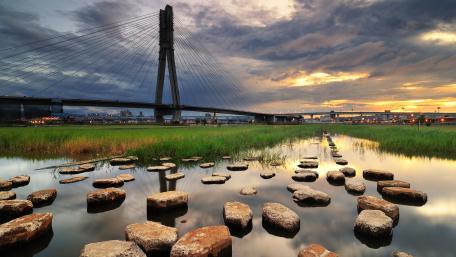 Serene Sunset Over a Tranquil River Scene wallpaper