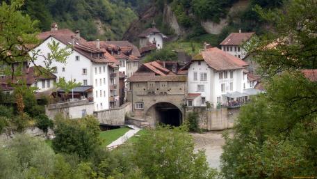 Charming Riverside Village in Lush Greenery wallpaper