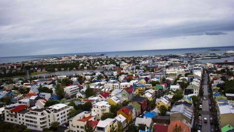 Vibrant Urban Landscape Overlooking a Coastal City wallpaper