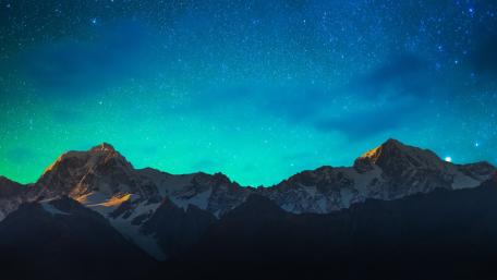 Majestic Mountain Under Starry Night Sky wallpaper