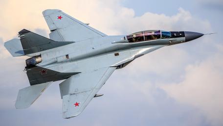 Sleek Military Jet in Dynamic Flight wallpaper