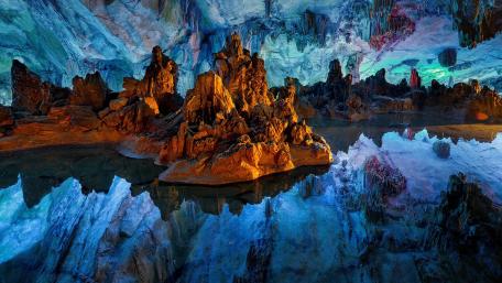 Majestic Underground Cave Landscape with Reflections wallpaper