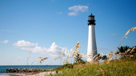 Coastal Serenity with a Lighthouse View wallpaper