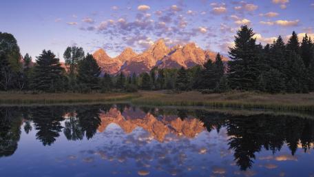 Majestic Mountains Reflected in Tranquil Waters wallpaper
