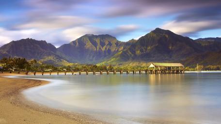 Serene Coastal Landscape with Majestic Mountains wallpaper