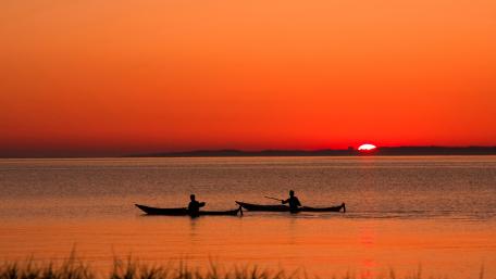 Serene Sunset Over Calm Waters wallpaper