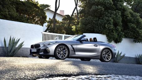 Sleek Convertible Car in Stylish Setting wallpaper