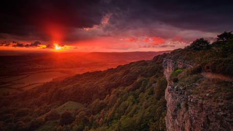 Majestic Sunset Over Rolling Hills wallpaper