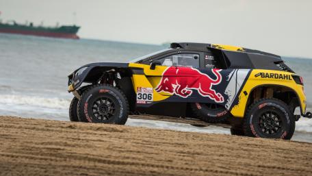 Dynamic Off-Road Racing Adventure on the Beach wallpaper