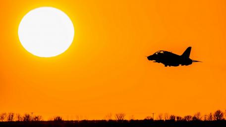 Sunset Flight Above a Golden Horizon wallpaper