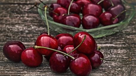 Fresh Red Cherries on Wooden Surface Artistry wallpaper