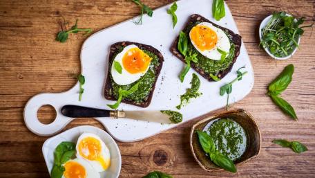 Delicious Avocado Toast with Perfectly Poached Eggs and Basil Pesto wallpaper
