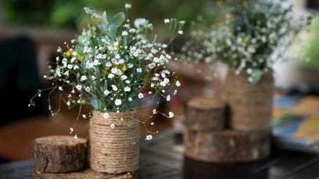 Charming Floral Arrangement in Rustic Vases wallpaper