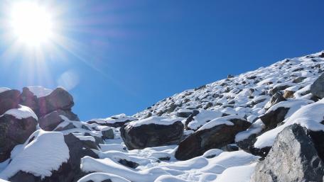 Winter Sunlight Over Snowy Terrain wallpaper