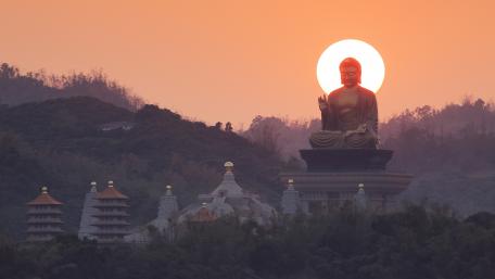 Serene Sunset over Buddhist Temple wallpaper