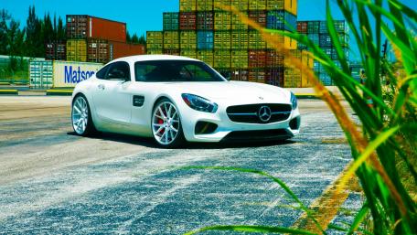 Sleek White Mercedes AMG in a Vibrant Setting wallpaper