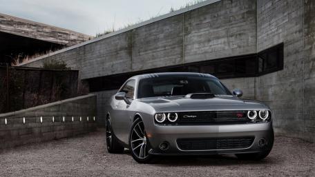Sleek Silver Muscle Car in Urban Setting wallpaper